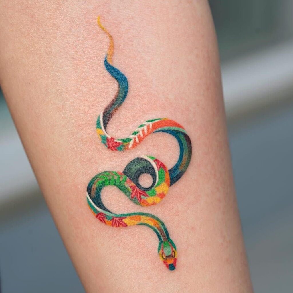 Snake tattoo on the forearm for women