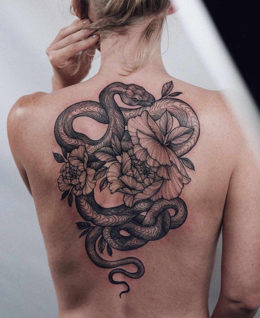 Snake tattoo on the back for women