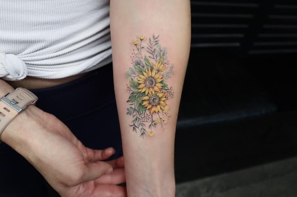 Sunflower tattoo on the forearm for women