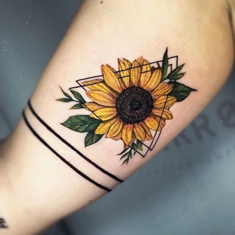 Colorful sunflower tattoo in a triangle on the arm for women