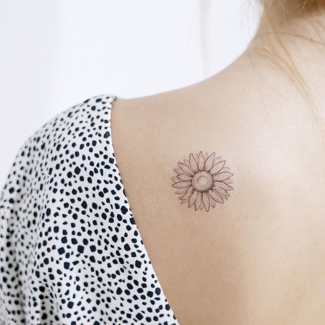 Small tattoo on the shoulder blade for women