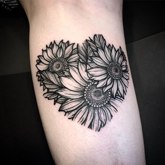 Sunflower tattoo on the calf for women