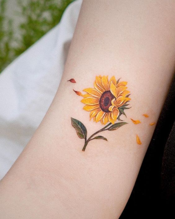 Colorful sunflower tattoo on the arm for women