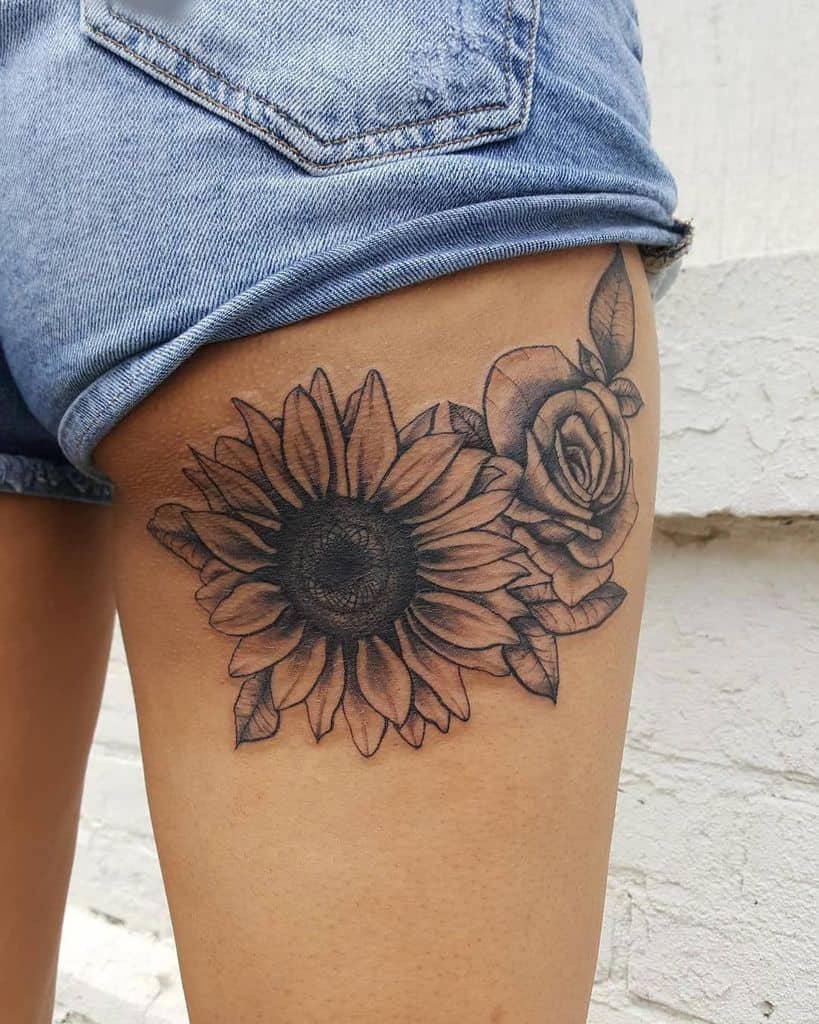 Large sunflower tattoo on the hip for women