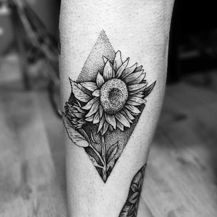 Sunflower tattoo on the leg for men