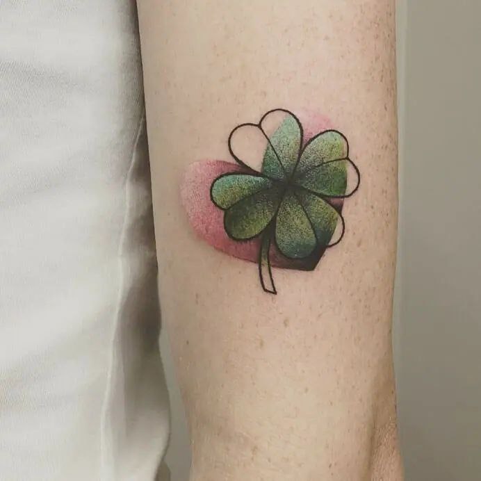 Colored clover tattoo on the shoulder for men