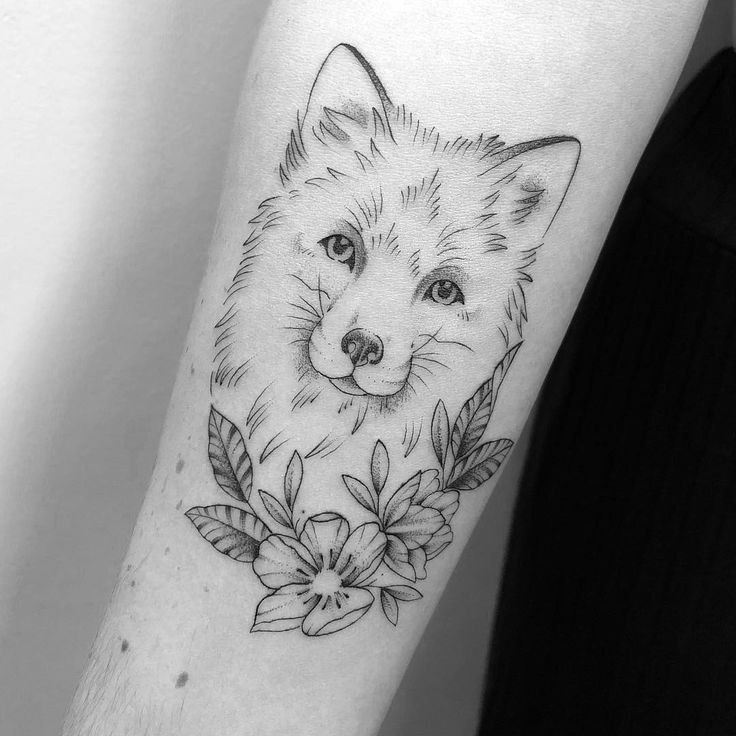 Fox tattoo on the forearm for women