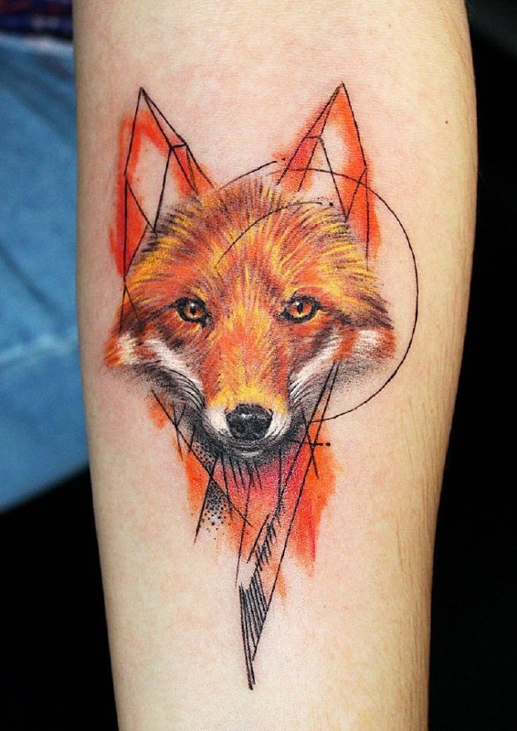 Tattoo of a colored fox on the forearm for women