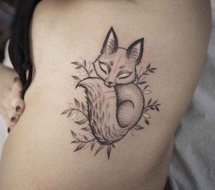 Tattoo of a fox on the belly