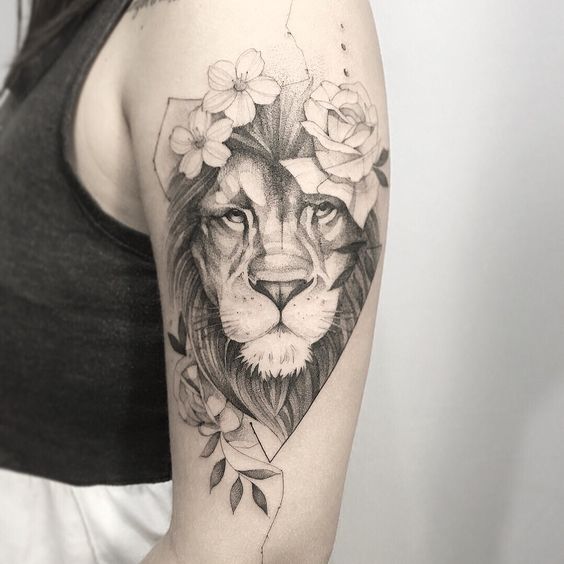 Tattoo of a lion on the shoulder for women