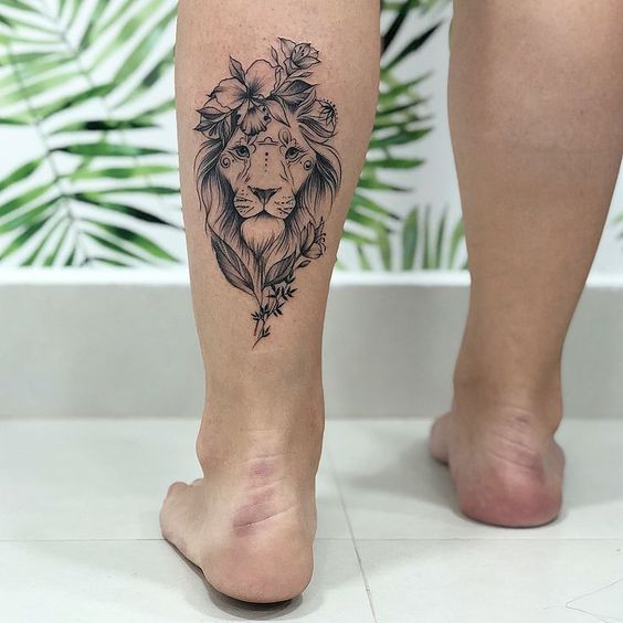 Lion tattoo on the calf for women