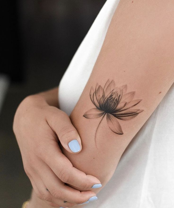 Lotus tattoo on the shoulder for women