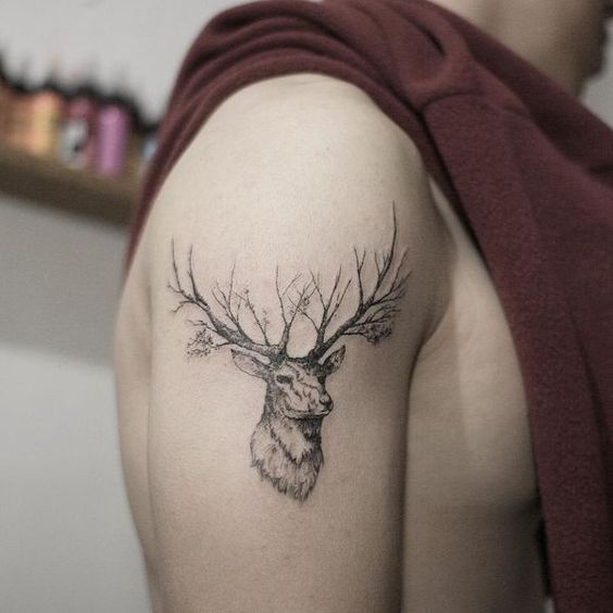 Tattoo of a deer on the shoulder for men