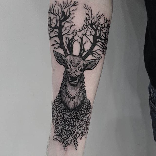 Tattoo of a deer on the forearm for men