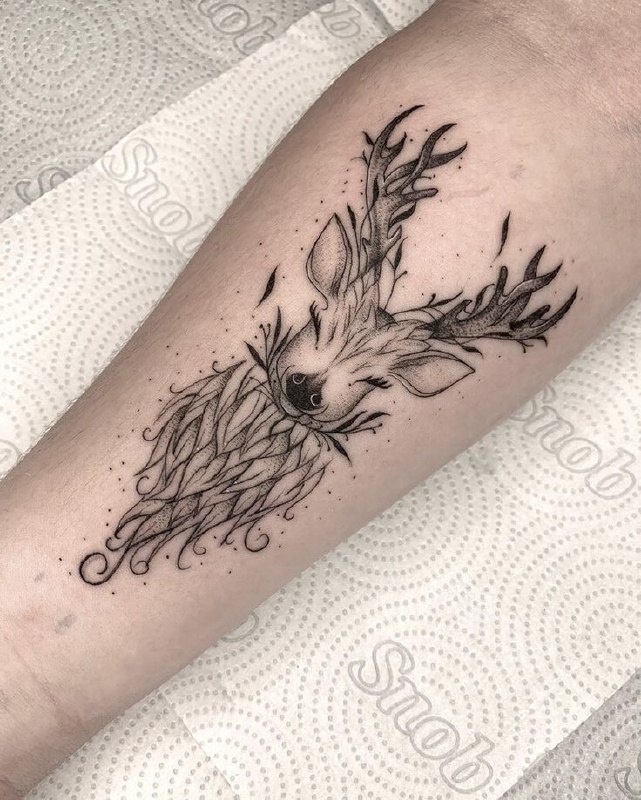 Tattoo of a deer on the forearm for men