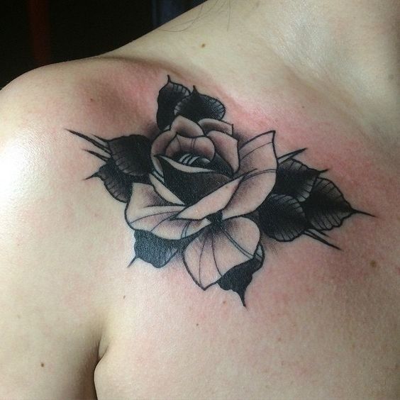 Tattoo of a rose on the collarbone for men