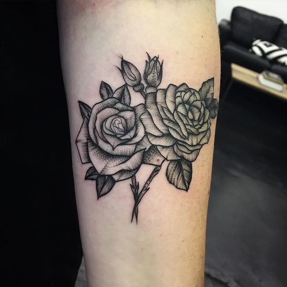 Rose tattoo on the arm for men