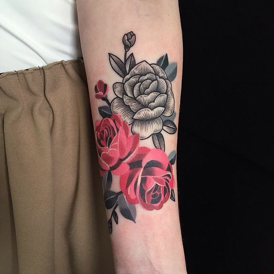 Colorful rose tattoo on the forearm for women