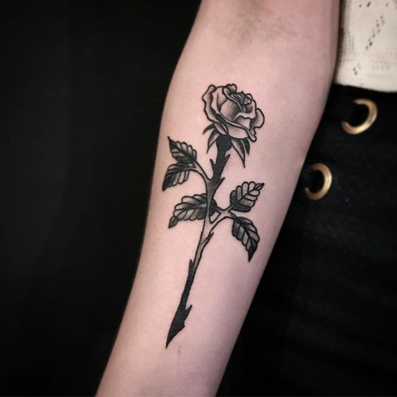 Rose tattoo on forearm for women