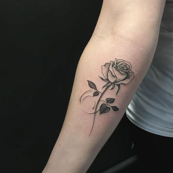 Tattoo of a rose on the forearm for men