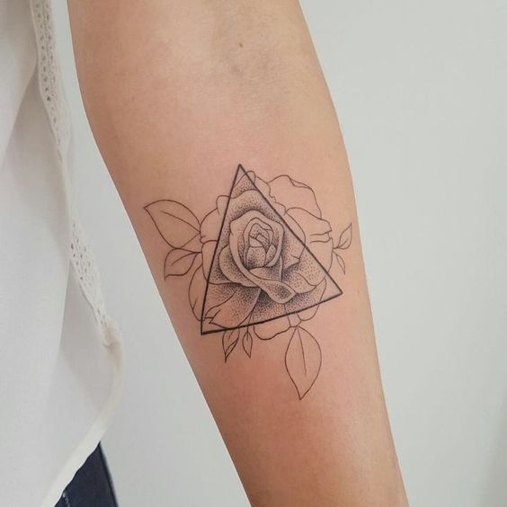 Rose tattoo in a triangle on the forearm for women