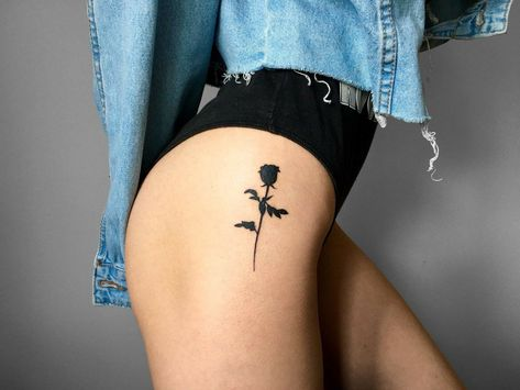 Rose tattoo on the hip for women