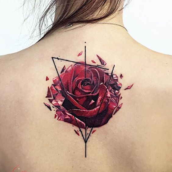 Large rose tattoo on the back for women