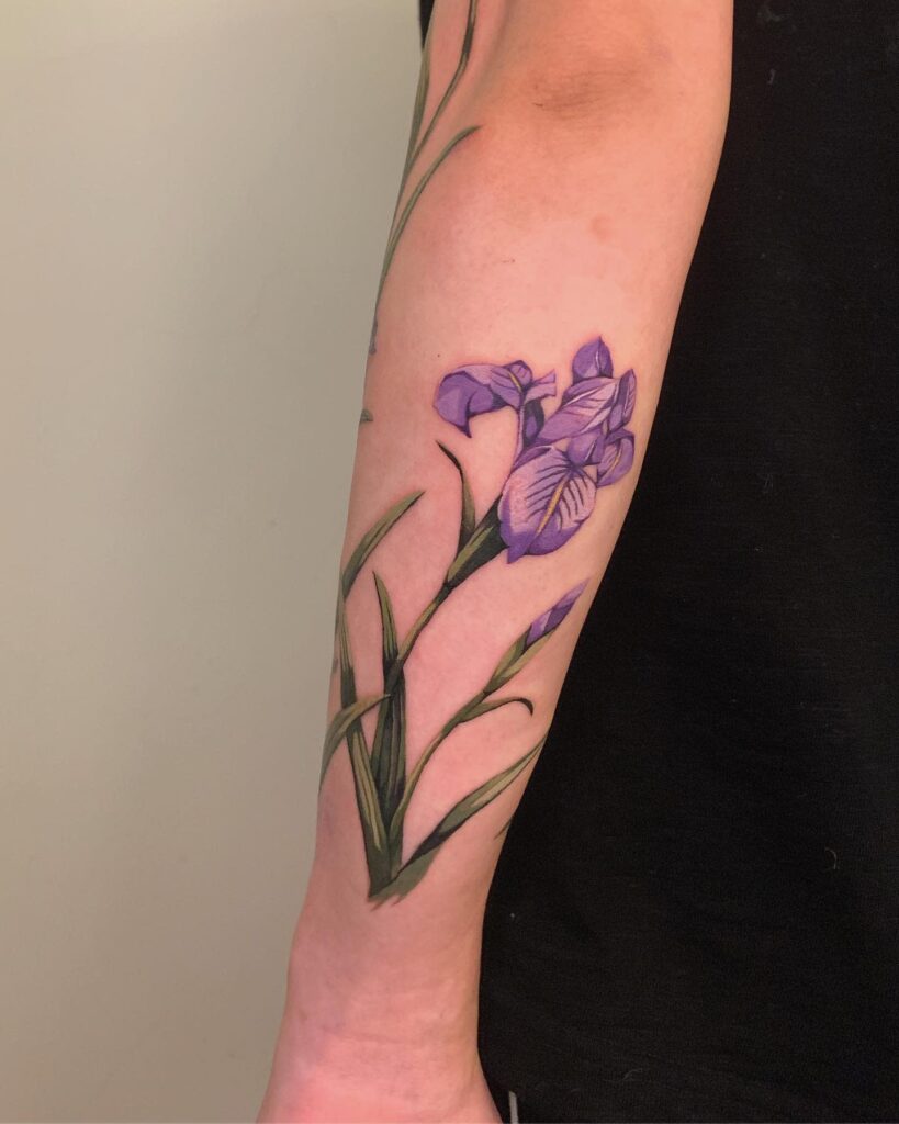 Color iris tattoo on the forearm for women