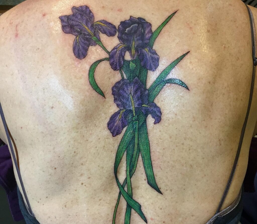 Color iris tattoo on the back for women