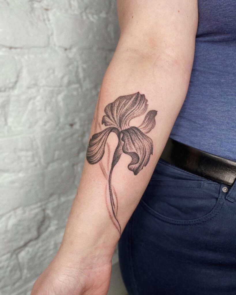 Iris tattoo on the forearm for women