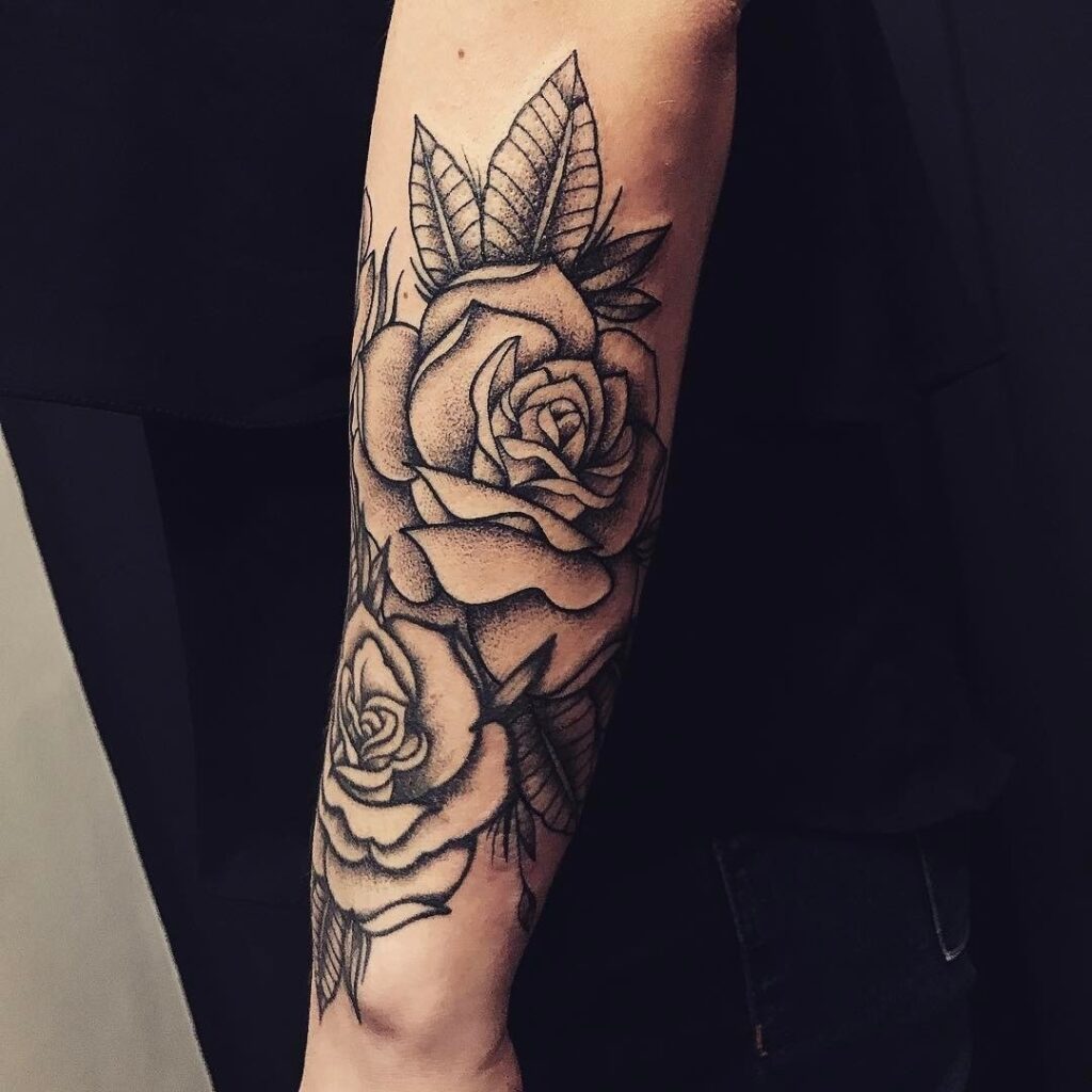 Tattoo of a rose on the forearm for men