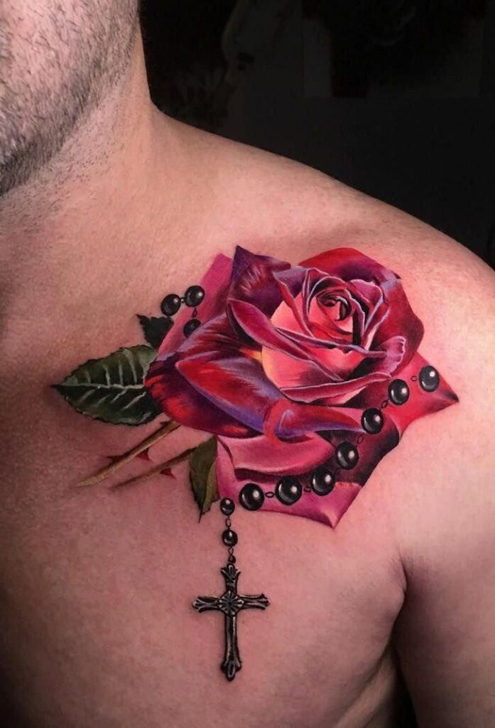 Tattoo of a rose with a cross on the collarbone for men