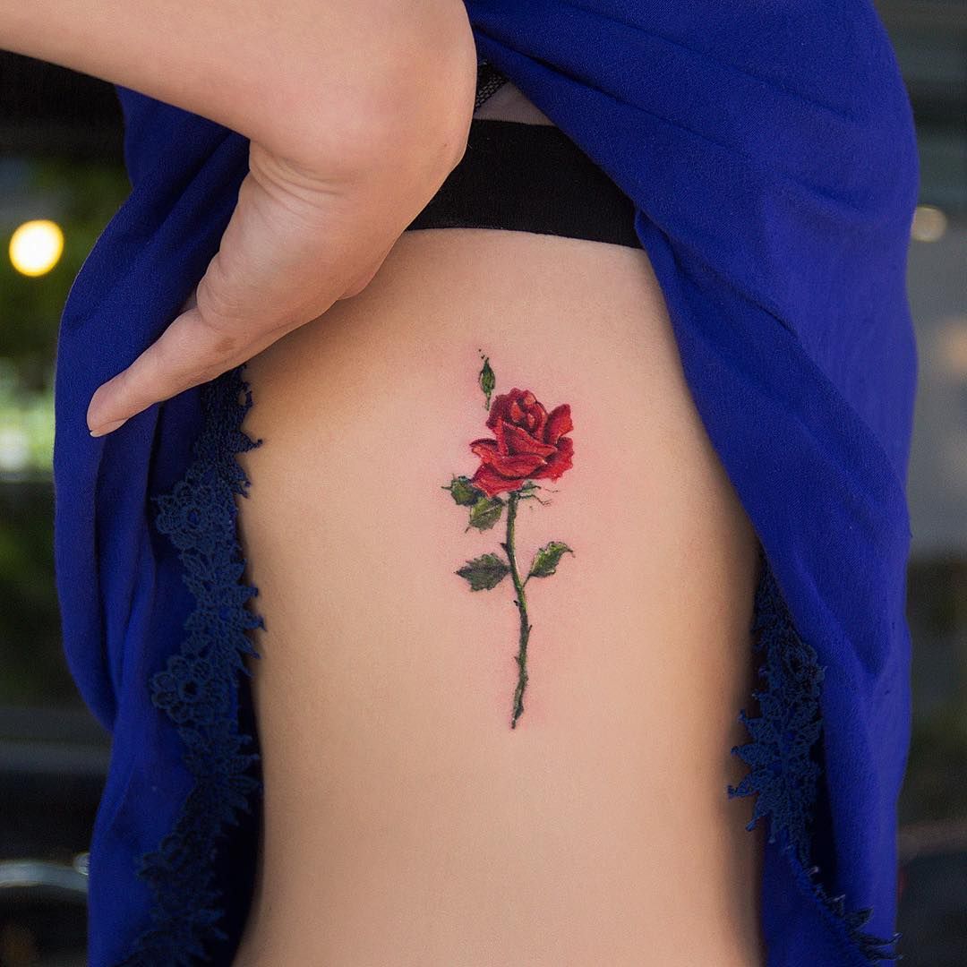 Colorful rose tattoo on the side for women