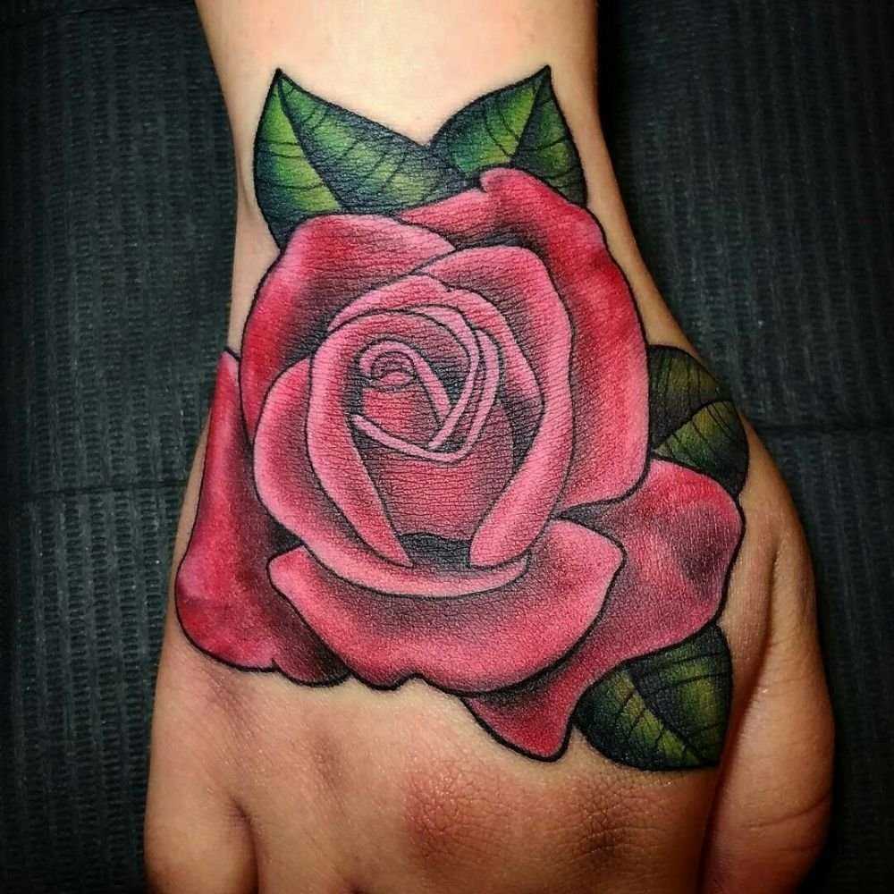 Large rose tattoo on the hand for women