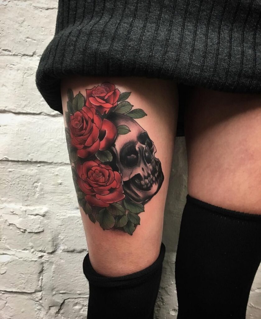 Rose tattoo with a skull on the hip for women