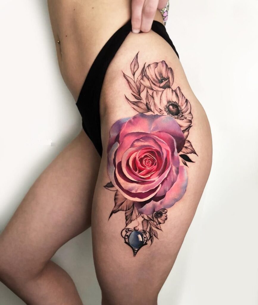 Large rose tattoo on the thigh for women