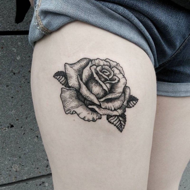 Rose tattoo on the hip for women