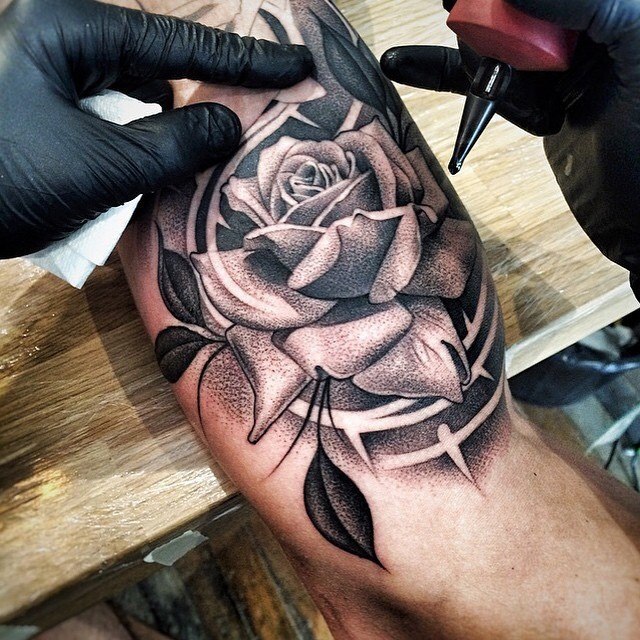 Large rose tattoo on the shoulder for men