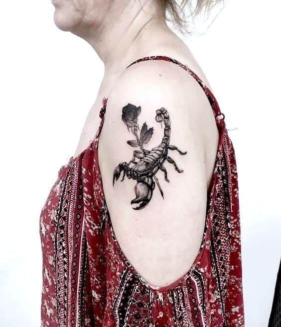 Scorpion and rose shoulder tattoo for women