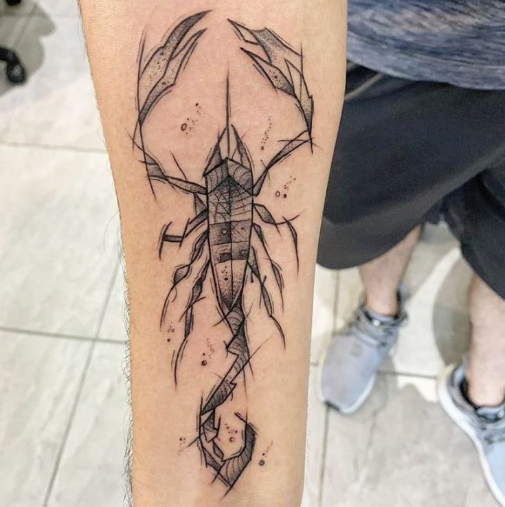 Tattoo of a scorpion on the forearm for men