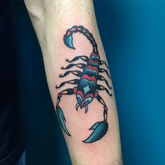 Color tattoo of a scorpion on the forearm for men