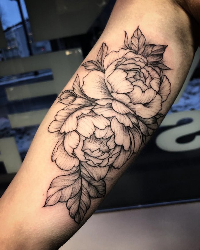 Peony tattoo on the forearm for men