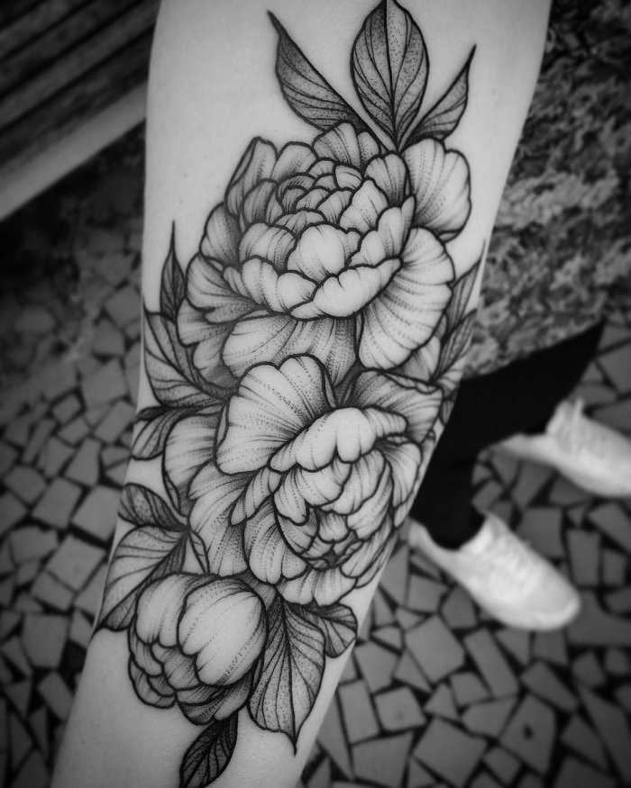 Peony tattoo on the forearm for men