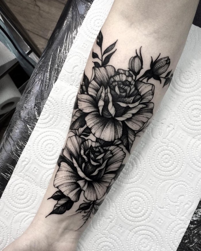 Peony tattoo on the forearm for women