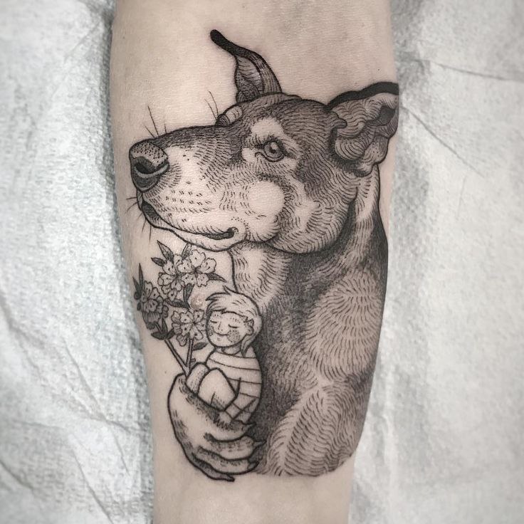 Tattoo of a dog on the forearm for men