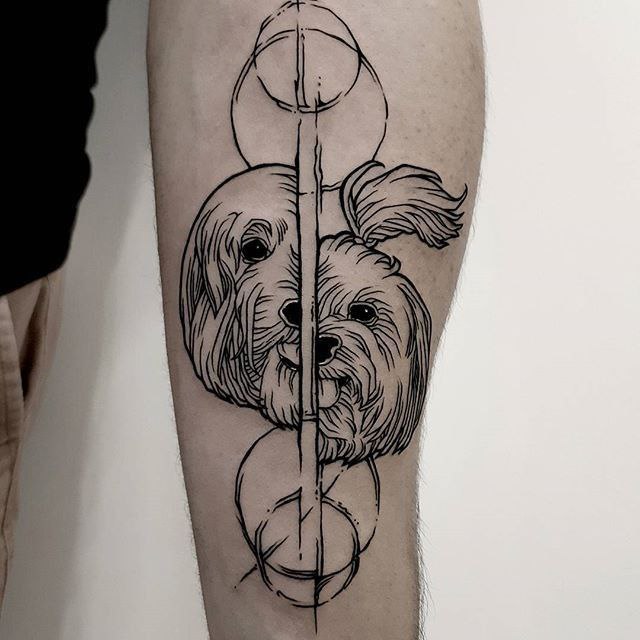 Tattoo of two dogs on the forearm for men