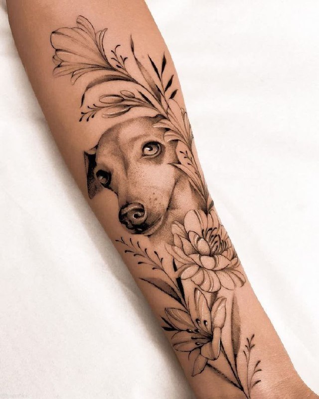 Tattoo of a dog on the forearm for women