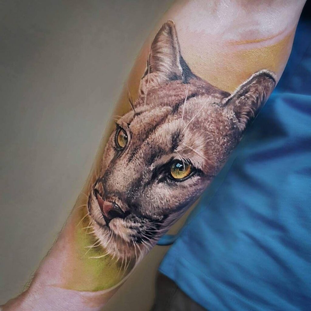 Puma tattoo on the forearm for men