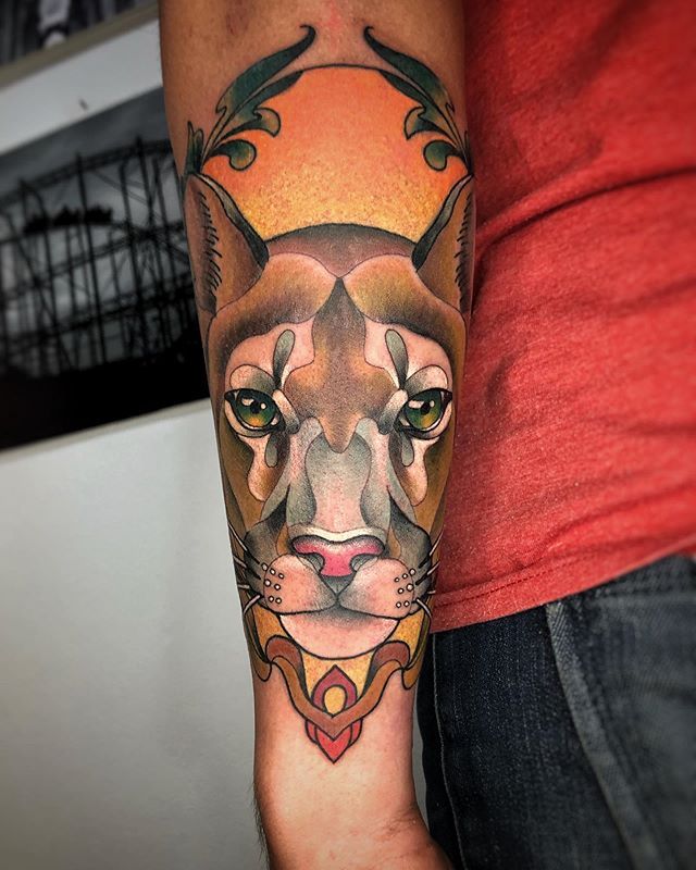 Puma tattoo on the forearm for men