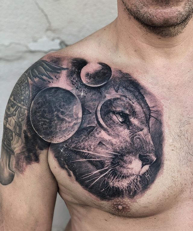 Puma tattoo on the chest for men